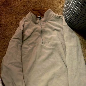 100% polyester, warm and soft and a really great sweater